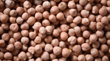 Arkaplanda çiğ organik kurutulmuş nohut dokusu. Vejetaryen sağlıklı beslenme. Üst görünüm, kopyalama alanı, sağlıklı yaşam tarzı konsepti.