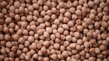 Arkaplanda çiğ organik kurutulmuş nohut dokusu. Vejetaryen sağlıklı beslenme. Üst görünüm, kopyalama alanı, sağlıklı yaşam tarzı konsepti.