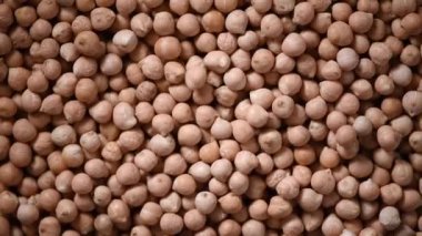 Arkaplanda çiğ organik kurutulmuş nohut dokusu. Vejetaryen sağlıklı beslenme. Üst görünüm, kopyalama alanı, sağlıklı yaşam tarzı konsepti.