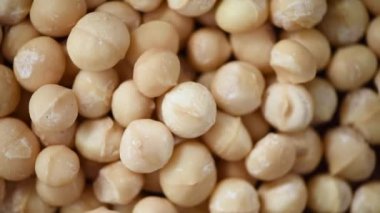 Macadamia fındık rotasyonu. Yemek malzemesi geçmişi. Vejetaryen diyeti. Sağlıklı bir yaşam tarzı. Doğal kuru meyve ve fındık konsepti ürünü.