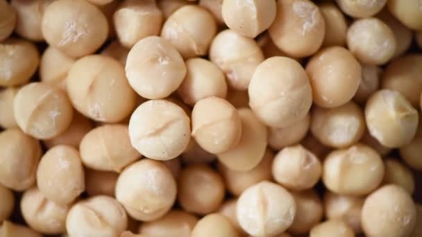 Rotazione di noci di macadamia. Sfondo ingrediente alimentare. Vegan, dieta vegetariana. Uno stile di vita sano. Frutta secca naturale e noci concetto di prodotto . — Video Stock