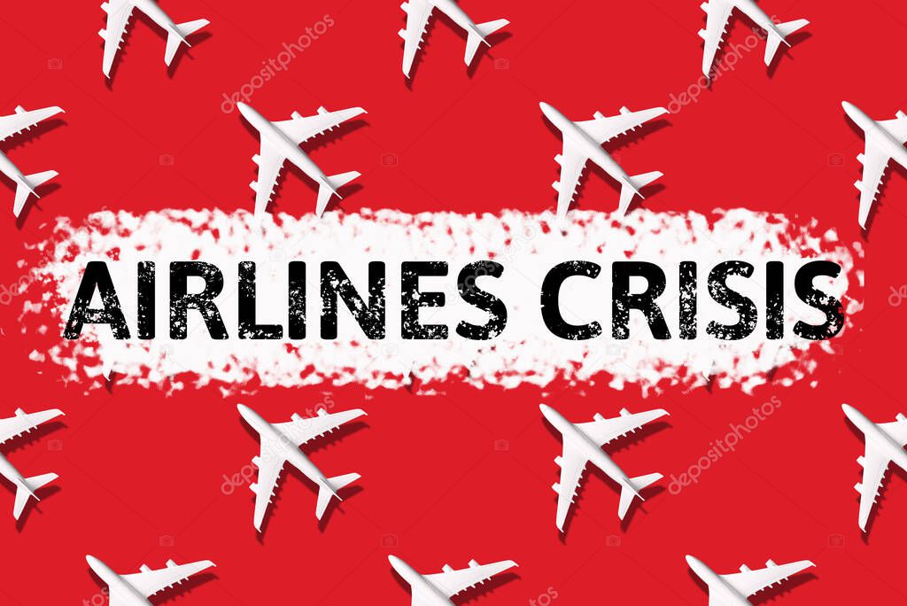 Crisis of airlines caused by Coronavirus COVID-19. Stay home. Airline crisis. Travel, vacation ban concept. Pattern of white airplanes. Flight cancellation due to impact of coronavirus Top view.