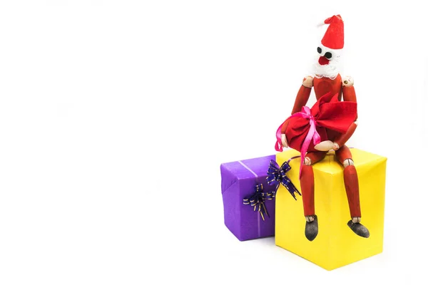 Creative santa wooden puppet toy with a bag of presents — Stock Photo, Image