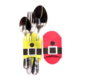 Noel çatal bıçak takımı sahipleri. beyaz izole kağıt el sanatları