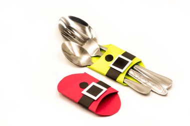 Noel çatal bıçak takımı sahipleri. beyaz izole kağıt el sanatları