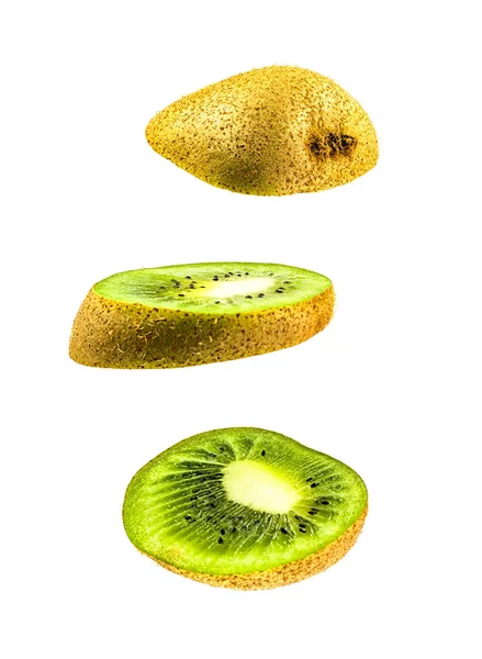 Sliced flying kiwifruit isolated on white background. cut kiwi in pieces isolated on white background. Levity kiwi fruit floating in the air. — Stock Photo, Image