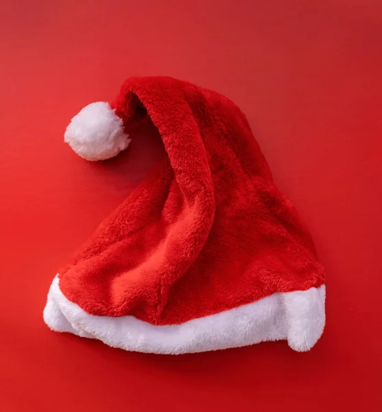 santa hat top view on red background