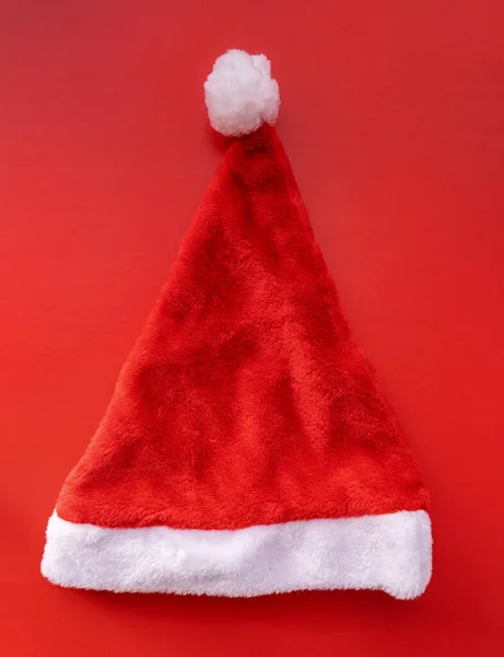 santa hat top view on red background