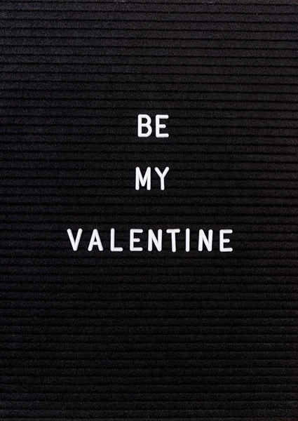 The words Be My Valentine on black felt letter board — 스톡 사진