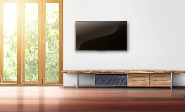 TV on white wall empty living room interior — стоковое фото