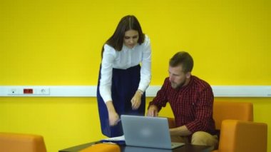 young businessman puts his signature in the documents