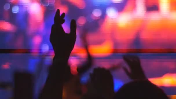 Togliatti,Russia,April 23,2016:silhouettes of concert crowd in front of bright stage lights — Stock Video