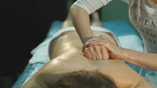 A woman doing therapeutic massage — Stock Photo, Image