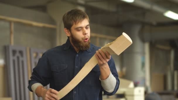Hardworking carpenter polishing wood using abrasive paper — Stock Video