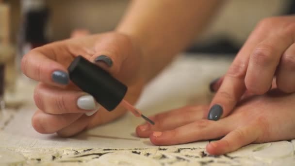 Mother and daughter painting their finger nails with polish — Stock Video