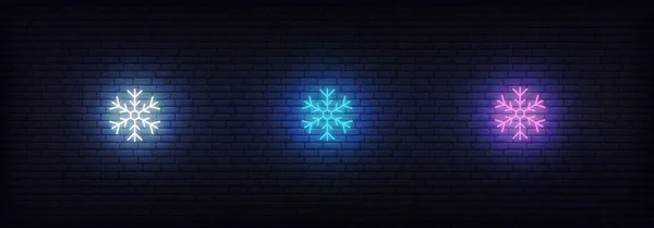 Ícone de floco de neve néon. Conjunto de ícones de neve coloridos de néon brilhante — Vetor de Stock