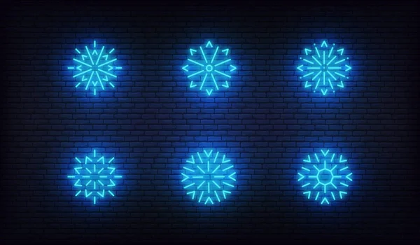 Schnee-Neon-Ikonen. Vektor leuchtende neonblaue Schneeflockensymbole — Stockvektor