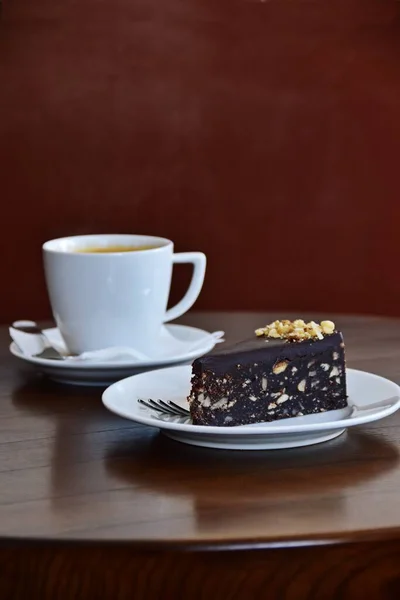 Slice of chocolate cake and cup of coffee. Coffee shop concept