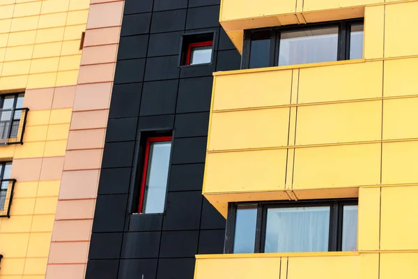 Facade of building with different colors. Black and yellow