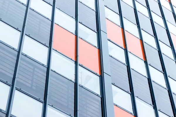 Facade of the building in orange and black colors