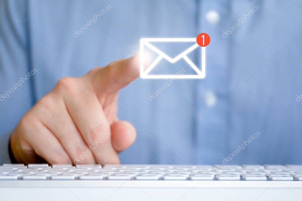 A man in a shirt in front of the keyboard. Abstract email icon with new message. Internet feedback concept.