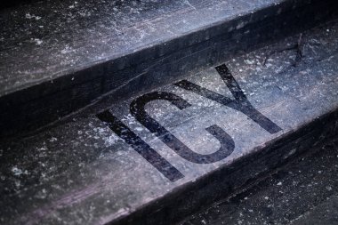Ice and snow on a wooden staircase. Word icy.