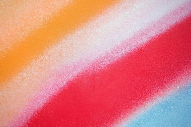 Metallic texture with multicolored paint sprayed on it