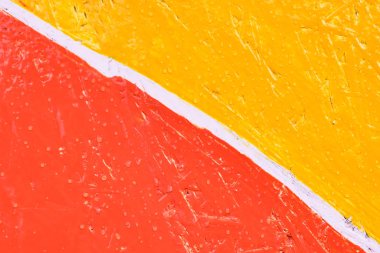 Red and yellow sawdust texture with white line.