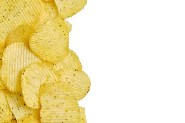 Chips with spices lie on a white background with copy space. — Stockfoto