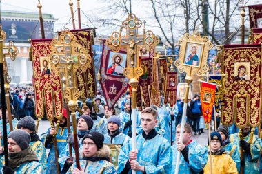 RUSSIA, ST.PETERSBURG - February 16, 2020: Orthodox priests and believers with icons are holding a procession. Close up.
