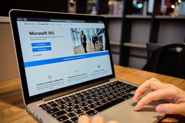 RUSSIA, ST.PETERSBURG - March 5: A girl browses the Microsoft 365 website on a laptop. Close up.
