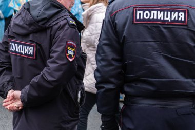 RUSSIA, ST.PETERSBURG - February 16, 2020: policemen officers from Russia are back on duty with the inscription - the police. Close up.