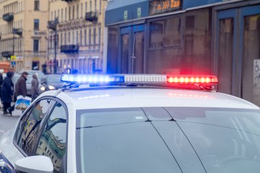 RUSSIA, ST.PETERSBURG - February 16, 2020: Police car with signal lights on - blue and red. Close up.