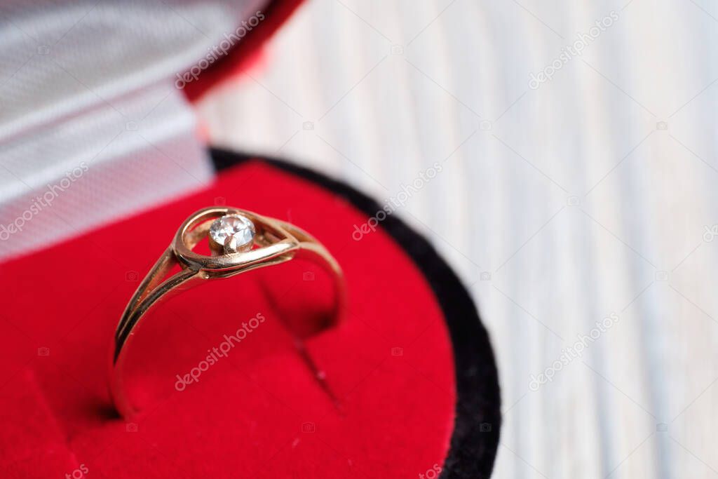 Gold ring in a gift box. The concept of getting married. Close up.