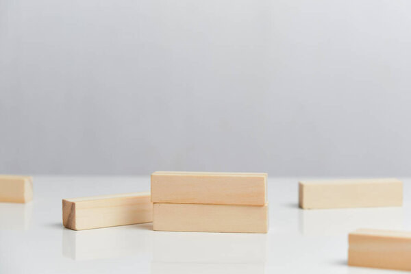 Bankruptcy concept. Wooden blocks on a white background background. Close up.