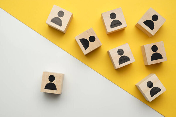 The concept of training staff, employees - wooden blocks with abstract people. Close up.