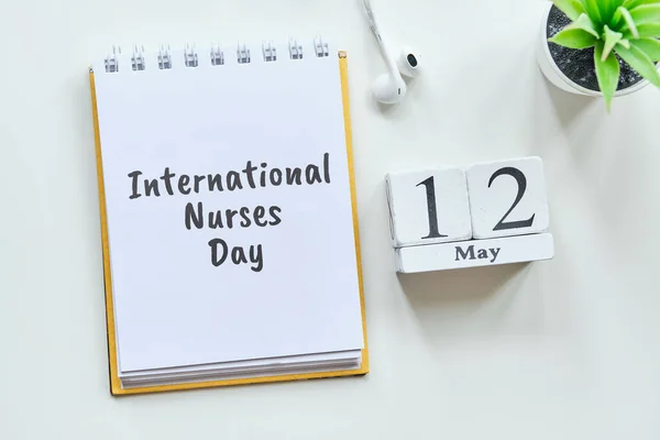 International Nurses Day 12 twelfth May Month Calendar Concept on Wooden Blocks. Close up.