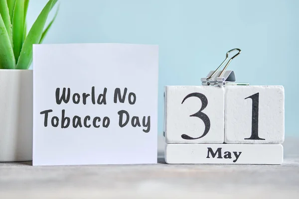 31 thirty first World No Tobacco day May Month Calendar Concept on Wooden Blocks. Close up.