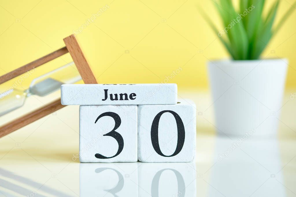 30 thirtieth day june Month Calendar Concept on Wooden Blocks. Close up.