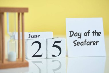 Day of the Seafarer 25 Twenty fifth june Month Calendar Concept on Wooden Blocks. Close up. clipart
