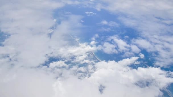 Beautiful cloudy and blue sky, view from flying airplane — Stock Video