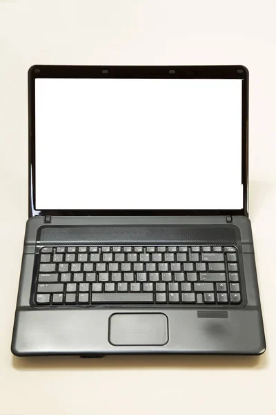 Computer portatile nero su sfondo di carta — Foto Stock