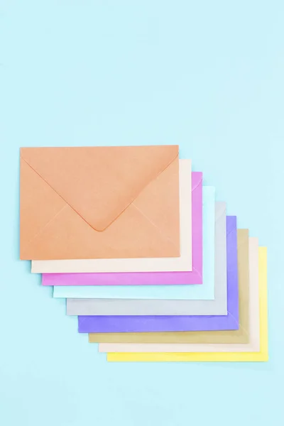 Colorful envelopes on blue — Stock Photo, Image