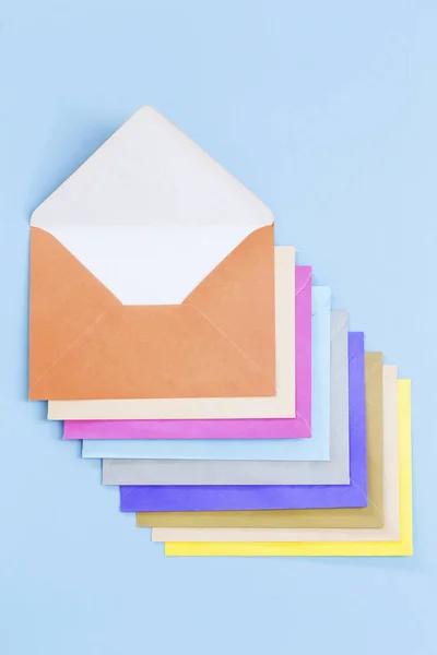 Colorful envelopes on blue — Stock Photo, Image