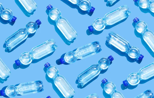 Mineral water bottles on blue background