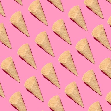 Pembe arka planda waffle külahı deseni