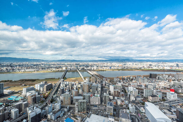 Osaka urban city and Yodo river from rooftop view. Japan.