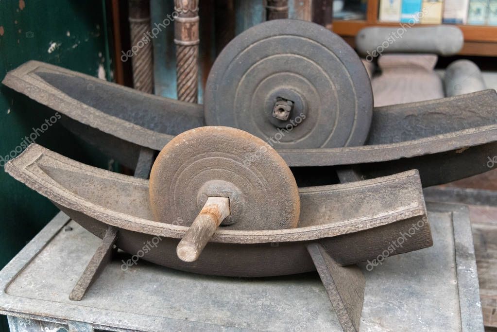 Antique herb roller mill grinding tool for make medicine. — Stock Photo © ohm_41 175361700