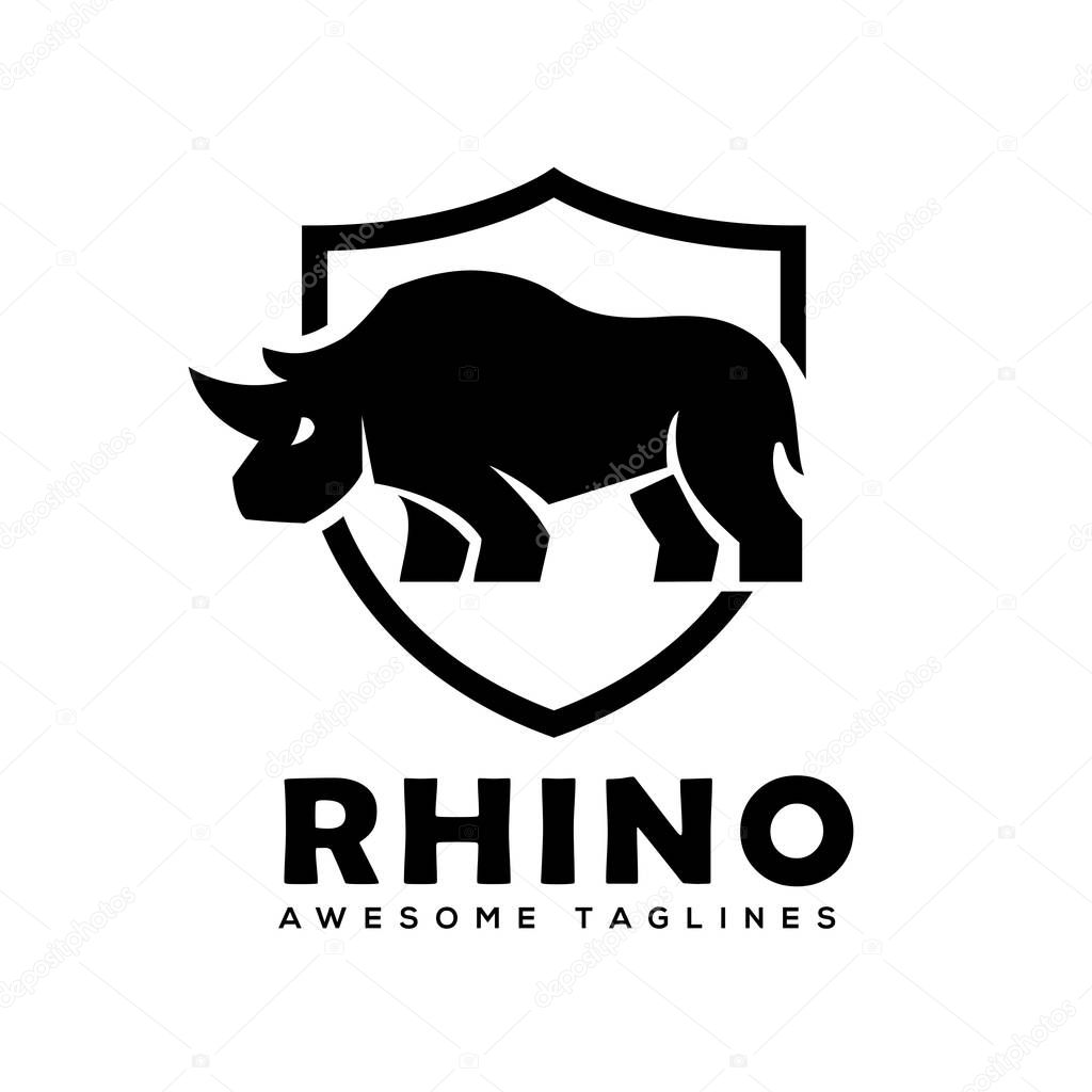 Rhino with shield logo vector, Rhinoceros shield logo monochrome color Business template, Rhinos logo for sport club or team. Animal mascot logotype , Vector illustration.