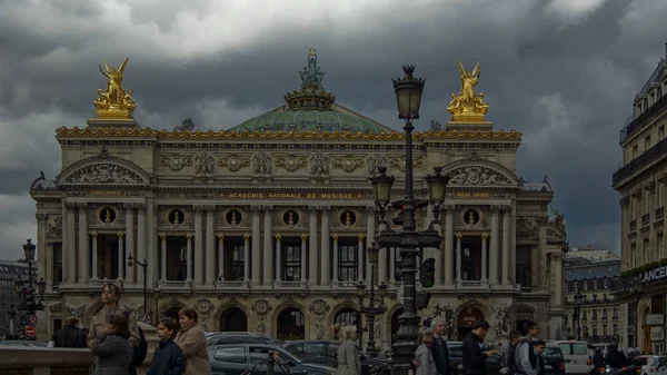 Paris, France-circa 2016:Traffic cars in front of Opera, Paris. The Palais Garnier is a 1,979-seat opera house, which was built from 1861 to 1875 for the Paris Opera.color grading — Stock Photo, Image